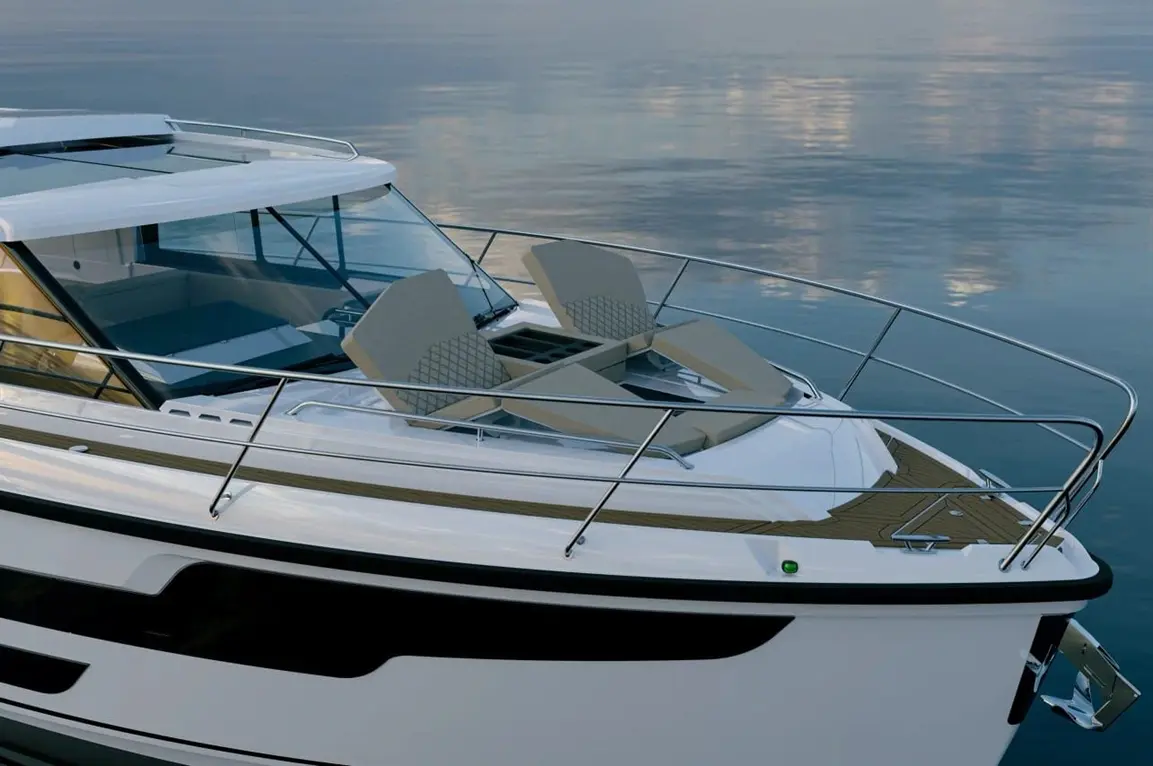 Luxury boat deck featuring two beige reclining seats, a polished railing, and a calm water reflection in the background.